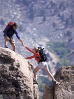 Picture of Hikers helping each other over cliff