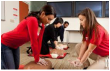 Instructor teaching correct CPR tecnhiques