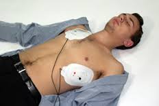 Image of man with AED Pads attached to bare chest